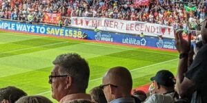 (Photo) LFC journo spots superb banner travelling Kop unveiled for James Milner at St. Mary’s