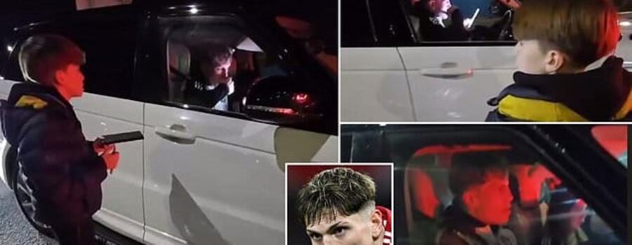 Awkward moment £50,000-per-week Manchester United star appears to IGNORE young fan pleading for an autograph and drives off while scrolling on his phone outside Old Trafford